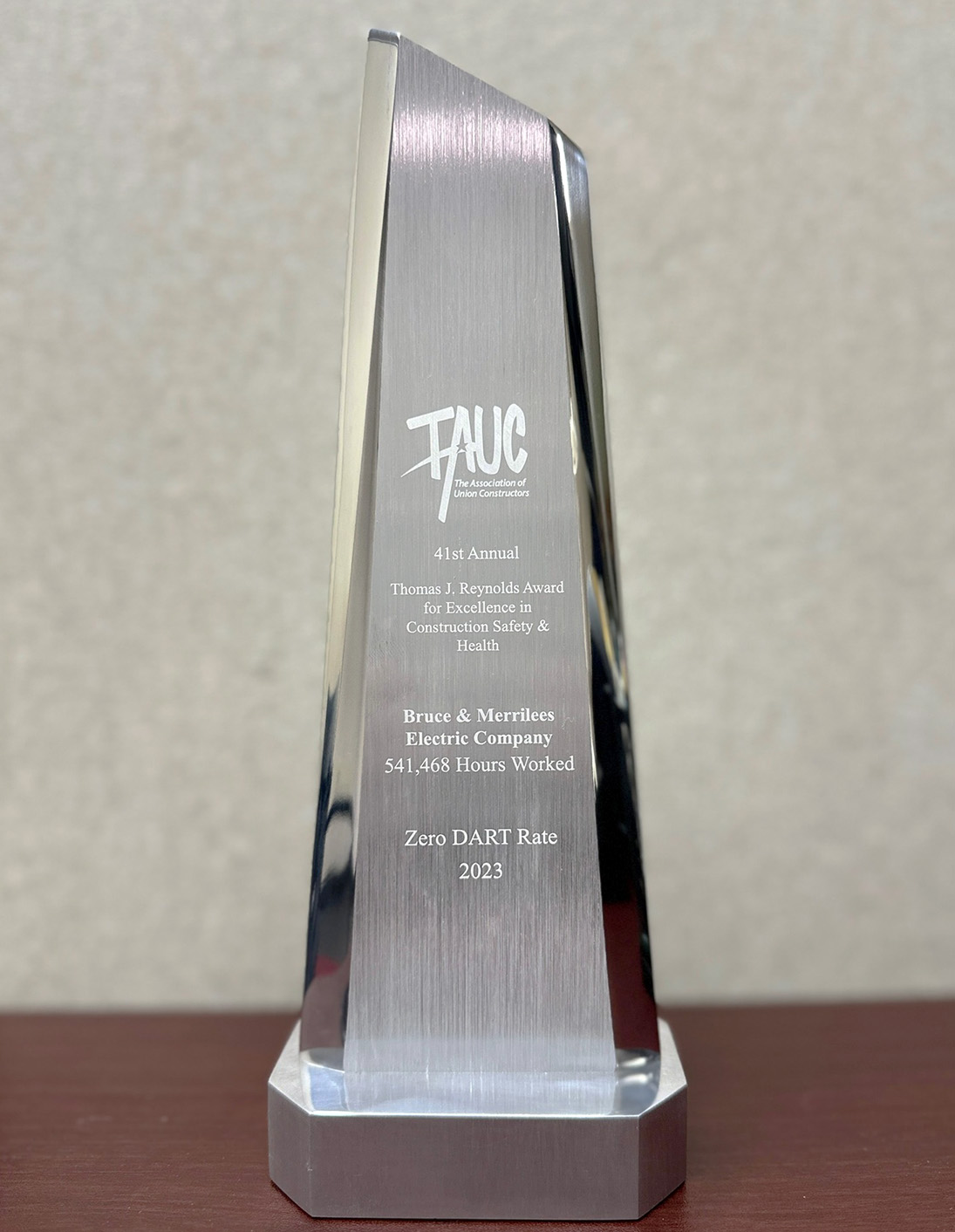 Engraved silver obelisk award from The Association of Union Constructors for zero DART safety rating